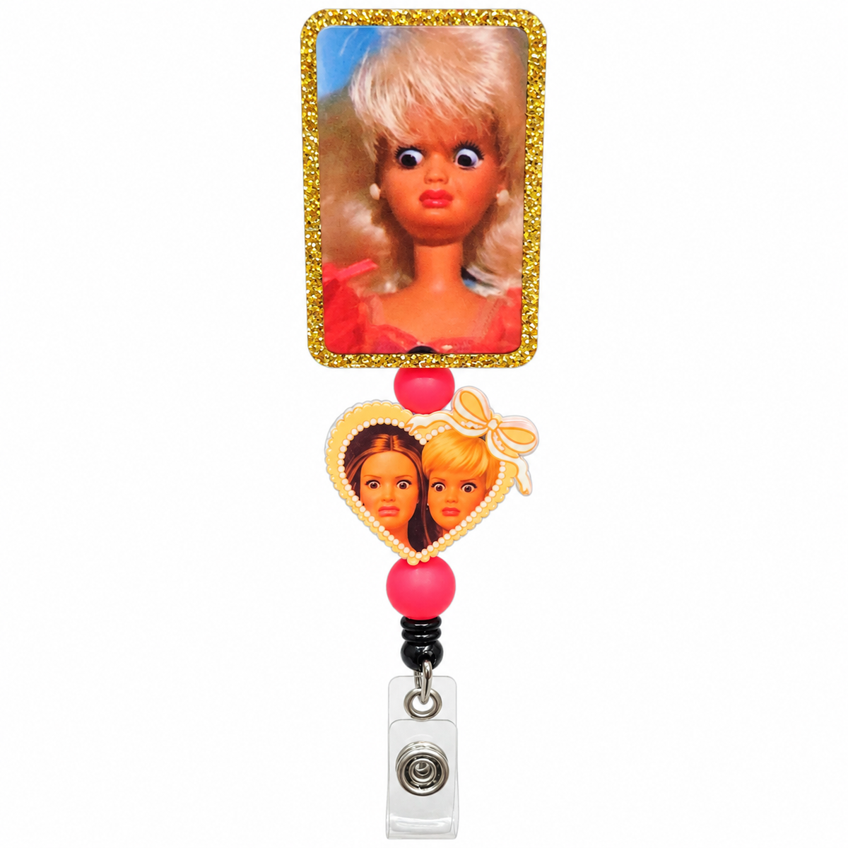 Funny retro blonde doll badge reel with gold glitter rectangular topper, heart-shaped double doll charm, pink decorative beads and retractable clear ID clip