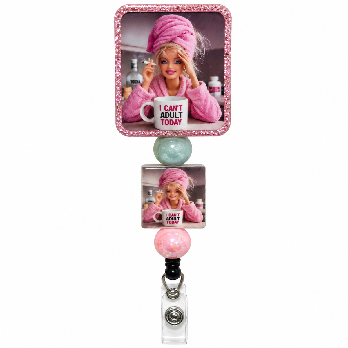 I Can't Adult Today beaded badge reel with blonde doll wearing pink robe and towel wrap, coffee mug, pink glitter topper, mint green bead, and pink bead.