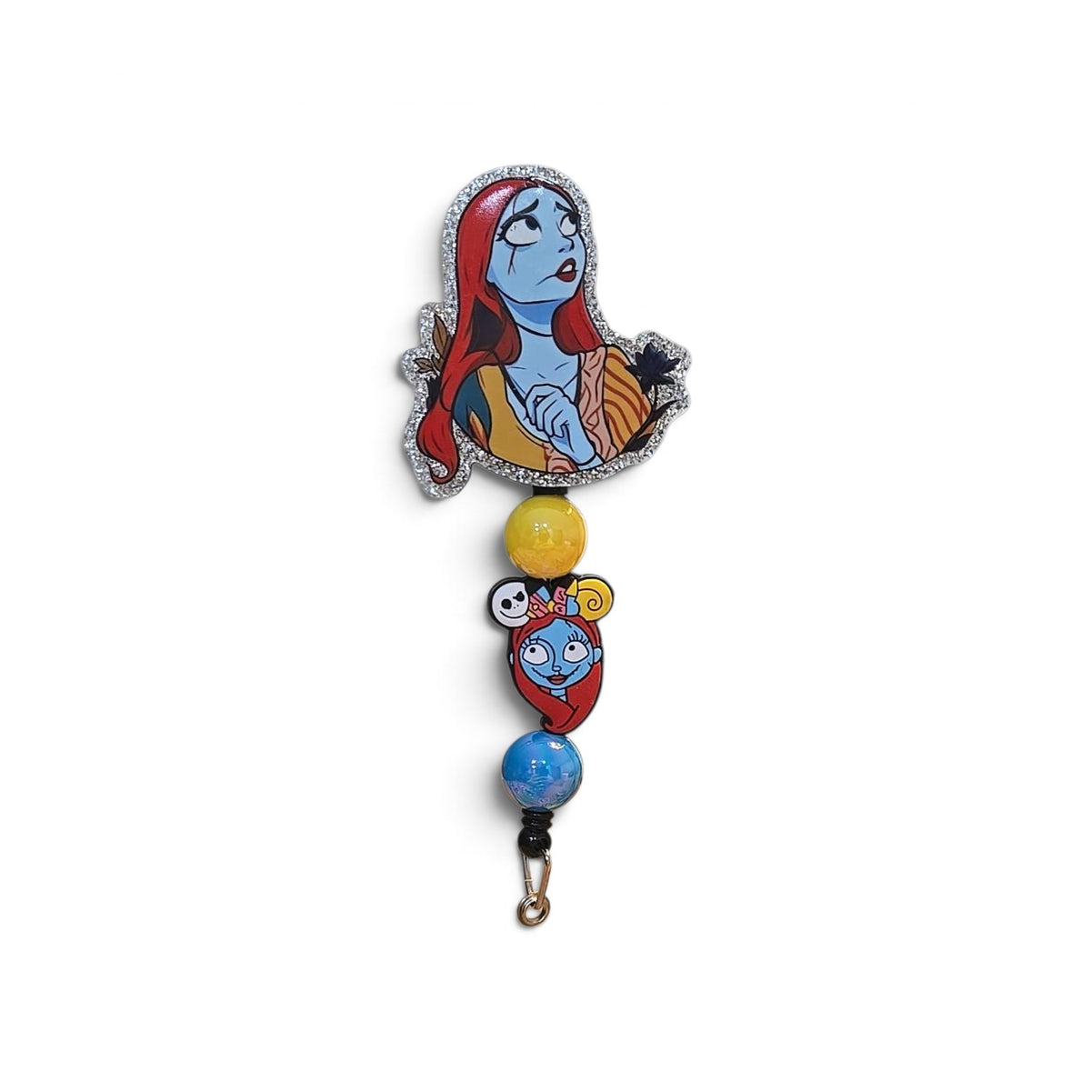 Sally Nightmare Before Christmas beaded badge reel with red-haired blue character, silver glitter border, yellow and blue beads, and Sally charm.