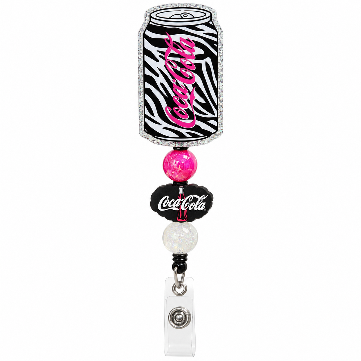 Coca-Cola zebra print badge reel with pink lettering, silver glitter trim, pink and white beads, and mini Coca-Cola charm.