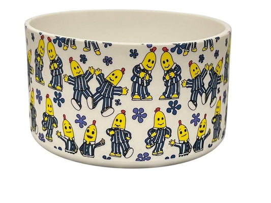 THE SALTY CHIC silicone tumbler boot featuring a white base with a playful Bananas in Pajamas print and blue flowers. Brumate Yeti Owala Simple Modern Stanley Hydrojug Frost Buddy
