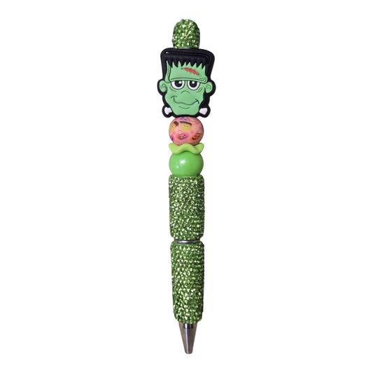 THE SALTY CHIC Frankenstein beaded pen with green glitter barrel and decorative Halloween focal beads