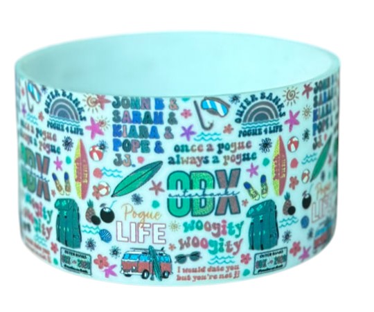 THE SALTY CHIC Outer Banks tumbler boot featuring colorful Pogue Life and OBX themed graphics on white silicone