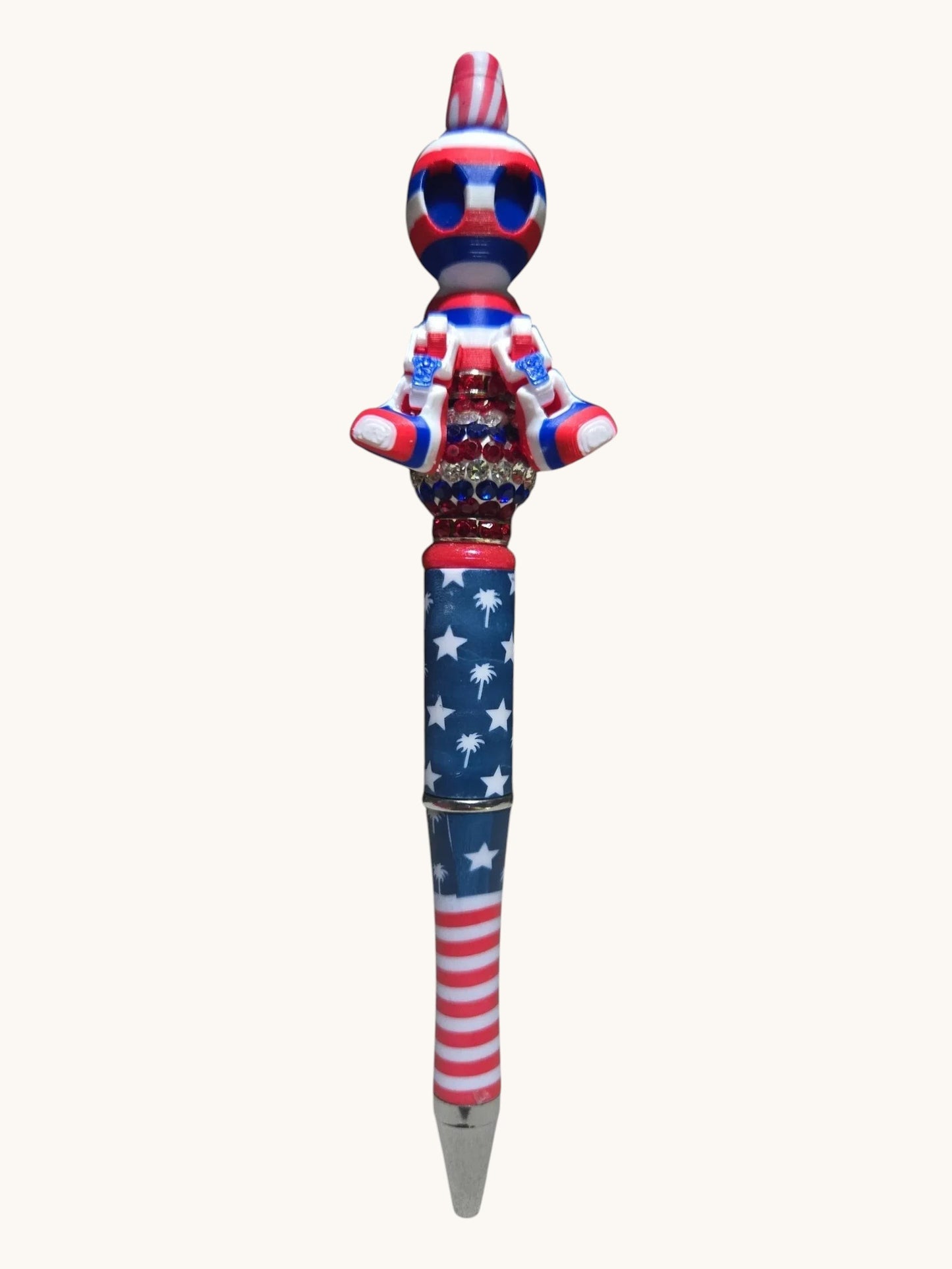THE SALTY CHIC patriotic writing pen with American flag pattern, rhinestone accents, and a custom character topper.