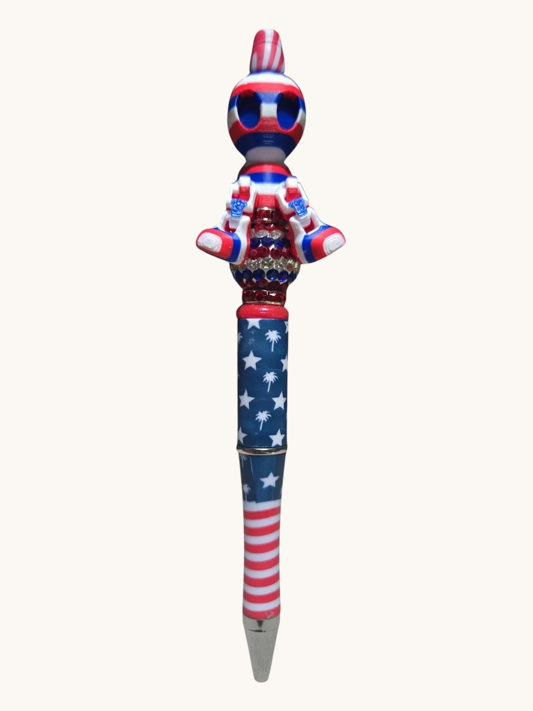 THE SALTY CHIC patriotic writing pen with American flag pattern, rhinestone accents, and a custom character topper.