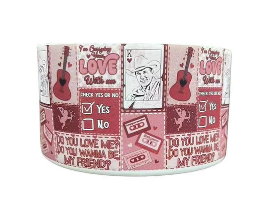 THE SALTY CHIC pink silicone tumbler boot with Carrying Your Love With Me guitar, cowboy, and cassette tape print.