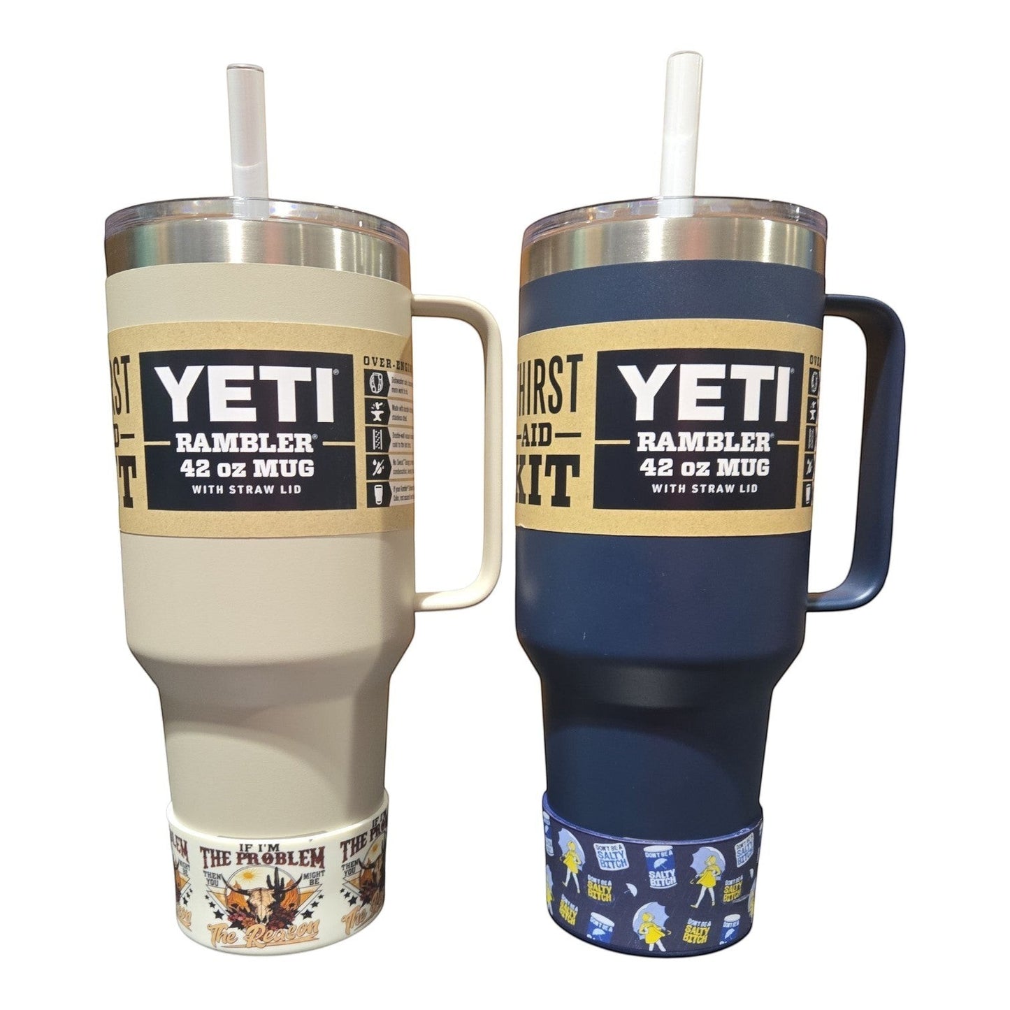 THE SALTY CHIC silicone tumbler boots featuring playful designs on two YETI Rambler 42 oz mugs in cream and navy blue.