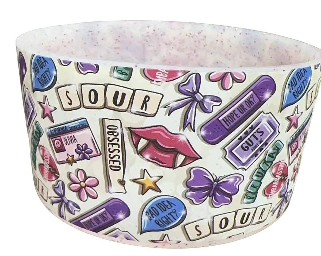 THE SALTY CHIC silicone tumbler boot featuring a colorful Sour-themed pattern with lips, butterflies, and text.