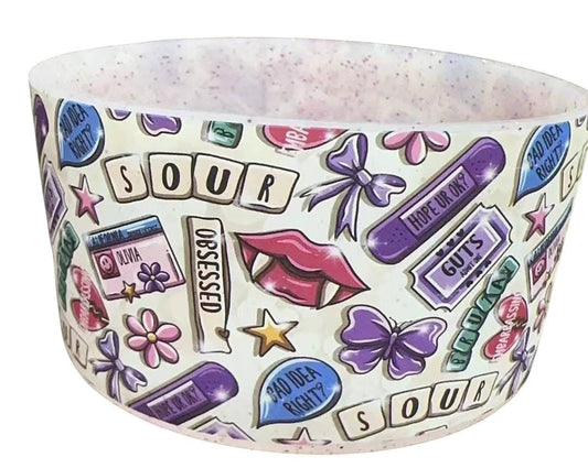 THE SALTY CHIC silicone tumbler boot featuring a colorful Sour-themed pattern with lips, butterflies, and text.